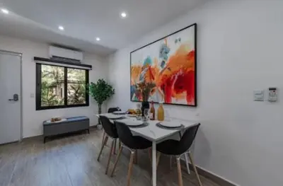 a dining room with a table and chairs at Luxury 2BR Villa by Tamarindo, AC, Private Yard in Tamarindo