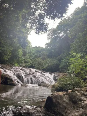 a waterfall in the middle of a river at Private Costa Rican Oasis with Pool River Views in Cóbano