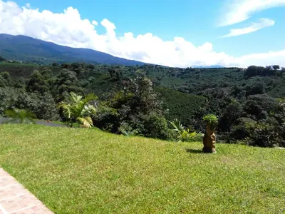 a fire hydrant on a grassy hill with a view at Supercostarica in Grecia