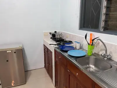 a kitchen with a sink and a counter top at Apartamento Río Niño in Upala
