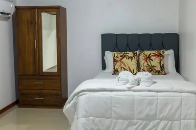 a bedroom with a bed with two towels on it at Apartamento Lantanas in Palma