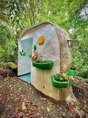 a mushroom house with two plants in it at River Cabin 1BR Breathtaking Chirripó Retreat in Tapantí