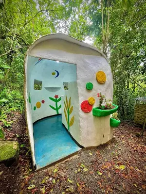 a small house with a door in the woods at River Cabin 1BR Breathtaking Chirripó Retreat in Tapantí
