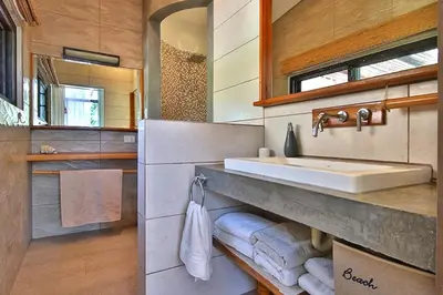 a bathroom with a sink and a mirror at Stef Surf Villa El Delfin in Potrero