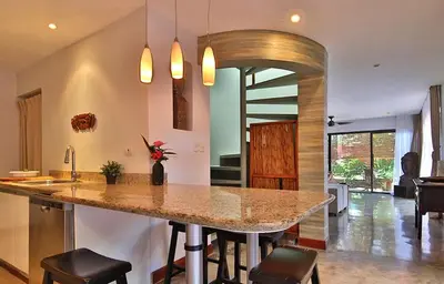 a kitchen with a large island in the middle of a room at Stef Surf Villa El Delfin in Potrero