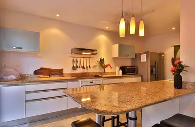 a kitchen with a counter and a island in it at Stef Surf Villa El Delfin in Potrero