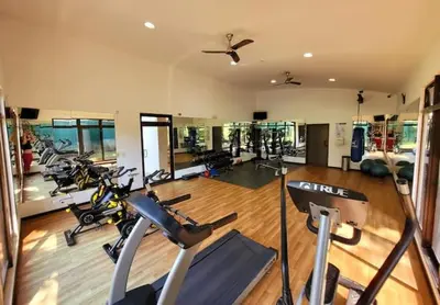 a gym with a bunch of exercise bikes in it at Walk to Downtown Santa Ana, Near Airport, Lush Gardens, Pool, King Bed, Security in Santa Ana