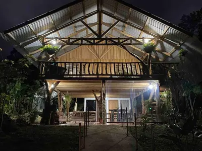 a house with a glass roof with potted plants on it at Cabin -Treehouse La Tigra in San Gerardo