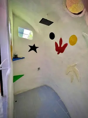 a room with planets and stars on the wall at green house in Rivas