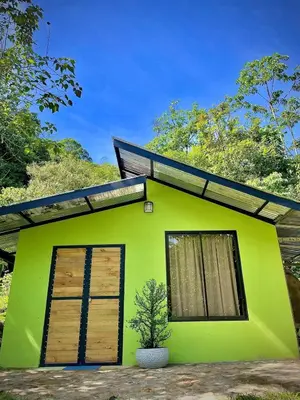 a green house with a plant in front of it at green house in Rivas