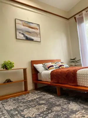 a bedroom with a bed and a window at Zen Mountain Escape 3BR Getaway near Chirripó in Rivas