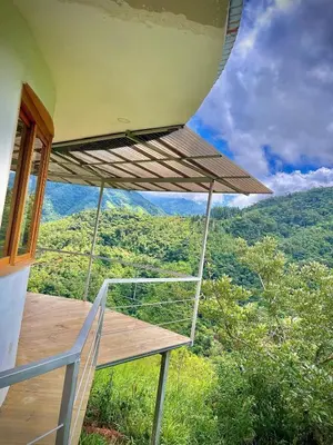 a balcony of a house with a view of the mountains at House on the Hill 1BR Costa Rica Jungle Escape in Rivas