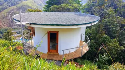 a small house with a roof on top of a hill at House on the Hill 1BR Costa Rica Jungle Escape in Rivas