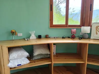 a wooden desk in a room with a window at House on the Hill 1BR Costa Rica Jungle Escape in Rivas