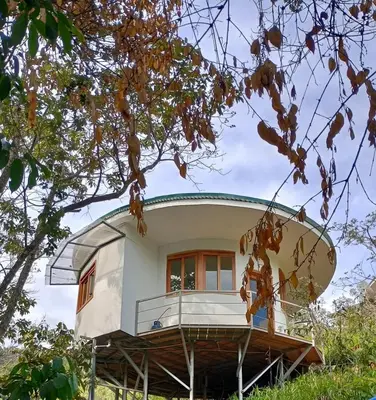 a house with a surfboard on top of it at House on the Hill 1BR Costa Rica Jungle Escape in Rivas