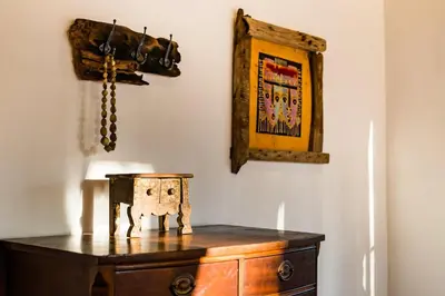 a wooden dresser in a room with a picture on the wall at Casa Rustica 1 in Playa Grande