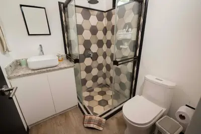a bathroom with a shower and a toilet and a sink at Casa Playa Avellanas in Playa Avellana
