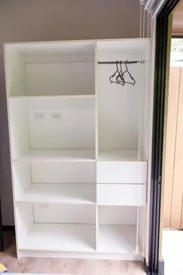 a white closet with white shelves in a room at Casa Playa Avellanas in Playa Avellana