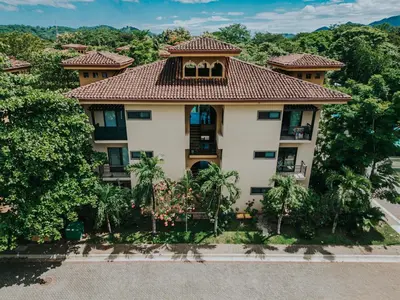 an aerial view of a house with a tiled roof at 2 beds -2 baths condos near Tamarindo Beach in Tamarindo