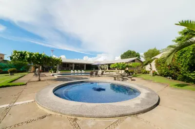 a swimming pool in the middle of a patio at Casa Cres, Beachfront, Private Pools, Tennis and AC! in El Roble