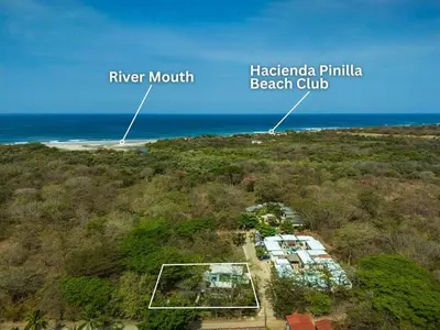an aerial view of a beach with the ocean at The Wave House in Santa Cruz