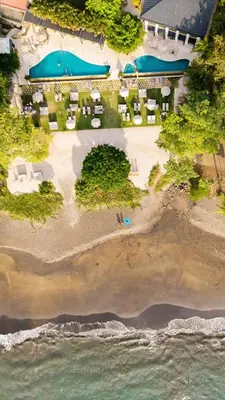 an aerial view of a beach with a resort at Casa Brisa Tranquila, Pools, Gym, & Beach Club in Sardinal