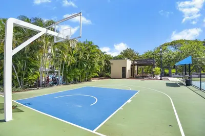 a basketball court with a basketball hoop at Sol Haven at Naumi, Pools, Gym & Beach Club in Sardinal