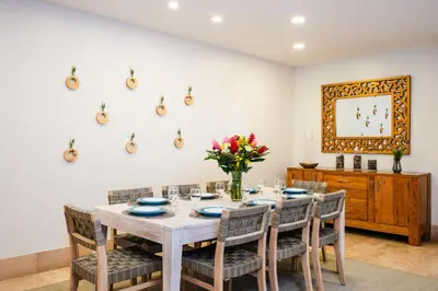 a dining room with a table and chairs at Stunning Remodeled Beachfront Condo! in Tamarindo