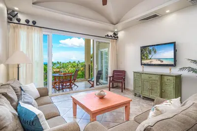 a living room with a couch and a table at Beautiful Ocean View Condo Steps to the Beach in Tamarindo