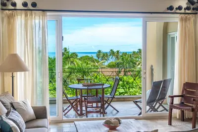 a living room with a view of the ocean at Beautiful Ocean View Condo Steps to the Beach in Tamarindo