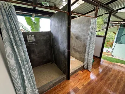 an inside view of a room with a bed in a house at Finca Renacer - Jungle Lodges in San Luis
