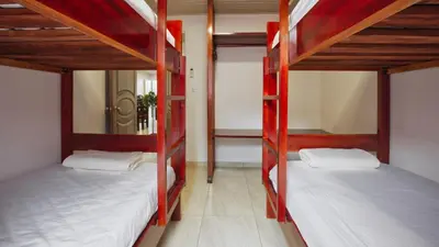 a room with two bunk beds in a room at Casa Sambola in Tortuguero