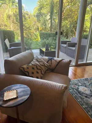 a living room with a couch and a table at Casa Esperanza Luxury Villa in Esterillos Este