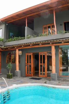 a house with a swimming pool in front of it at Private Wellness Home Sauna, Jacuzzi &Cold Plunge in Brasil