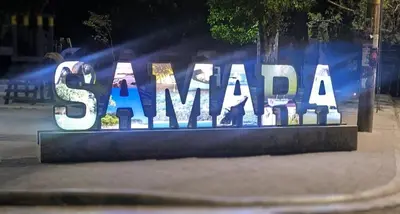 a sign that says santa claus in a city at night at Casa Azul Tropical Poolside Oasis in Sámara in Sámara