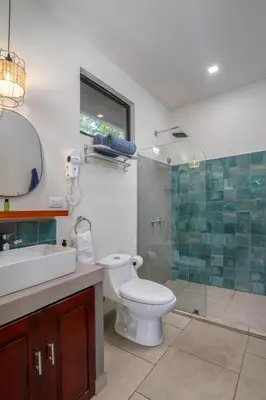 a bathroom with a toilet and a sink and a shower at Casa do Mar in Cebadilla