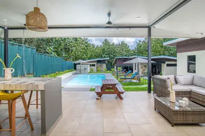 a patio with a couch and a table and a pool at Casa do Mar in Cebadilla