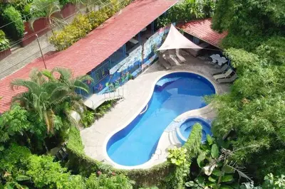 an overhead view of a swimming pool in a resort at Villas El Parque 18B Central Studio Apartment in Quepos