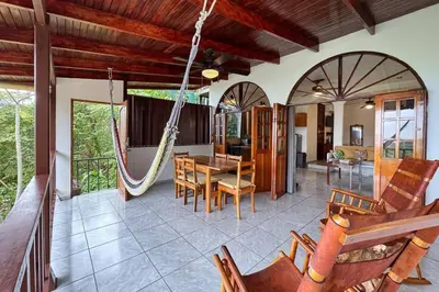 a living room with a hammock in a house at Villas el Parque 18A 1BR Central Apartment w Huge Patio in Quepos