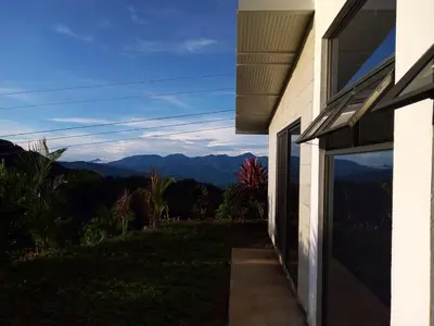 a house with a view of the mountains at Palco Pacífico Villa with Private Rooftop Pool in Alto del Monte