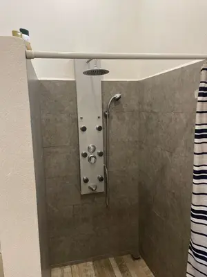 a shower with a shower curtain in a bathroom at Palco Pacífico Villa with Private Rooftop Pool in Alto del Monte