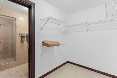 a bathroom with a shower and a towel on a wall at Mir3 Tamarindo 2BR Ocean View Retreat in Tamarindo