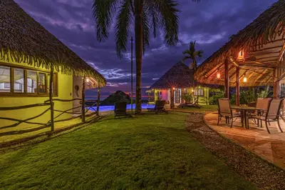 a house with a yard with a table and chairs at TikiVibez in Coronado