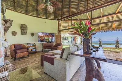a living room with a couch and a table at TikiVibez in Coronado