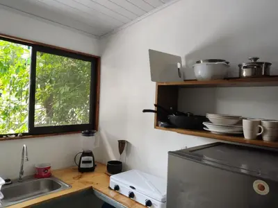 a kitchen with a sink and a window at Apartamentos el Espavel in Santa Teresa Beach