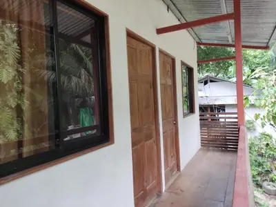 an open door of a house with a porch at Apartamentos el Espavel in Santa Teresa Beach