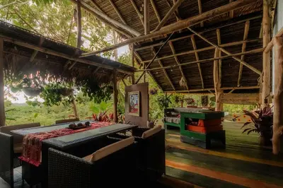 a room with chairs and a table in a building at Unique design and cozy property in Playa Hermosa