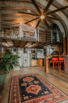 a large living room with a rug on the floor at Unique design and cozy property in Playa Hermosa