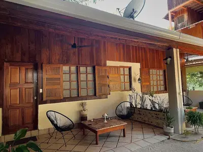a porch of a house with a table and chairs at Nagomi Casita #1 in Sámara