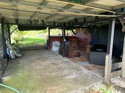 a covered patio with a toilet in a house at El Spot Orgánico in Quesada